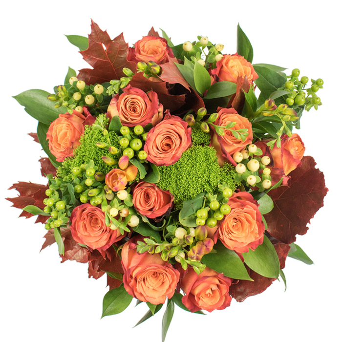 Viewed from directly overhead on a crisp white field, this autumn-inspired bouquet feels like a carefully composed harvest study. The design is dominated by many fully opened roses whose petals move from a warm, inner peach through coral to burnt-orange and russet tips, creating a natural ombré that suggests turning leaves. Between those classic roses, bright clusters of small, round berries add lively accents - some a neon lime green, others a soft cream-yellow - their smooth, glossy textures contrasting with the roses' velvety faces. Compact, cushiony tufts of Green Trick dianthus appear like miniature green hills, dense and tactile, bringing an unexpected, almost playful sculptural element to the arrangement. Deep, broad green leaves form a luxuriant backdrop, while a selection of dark, rust-toned lobed leaves reminiscent of oak or maple introduces a rustic, anchoring counterpoint. The overall palette-soft peach, coral-orange, rich burgundy, and many greens-reads as both celebratory and comforting. Under soft studio light, each element casts delicate shadowing, enhancing the bouquet's three-dimensional presence. This piece evokes the scents of late-season gardens-rose sweetness warmed by an earthy, leafy undercurrent-and carries the quiet hospitality of a seasonal table set near the Thames or for a cosy gathering in a Greenhithe home. Ideal as a Thanksgiving focal point, an autumnal gift, or a seasonal statement, its abundant texture and colour speak to careful, experienced floral craftsmanship and a love for the season's comforts.